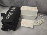 Thermal Angel battery pack with white control unit, cable, and black storage bag