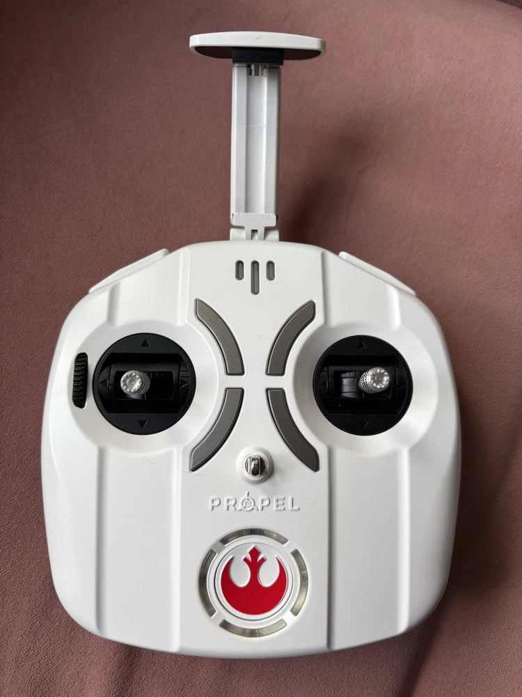 White Propel RC remote controller with two black control sticks and Propel logo