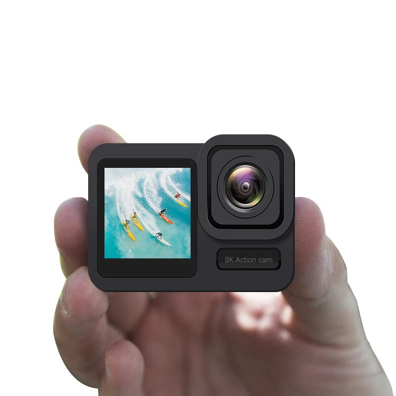 Action sports camera with dual touch screens and waterproof housing, held in hand