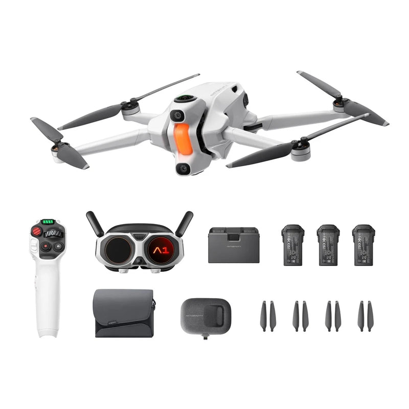 Foldable white quadcopter drone with controller, spare batteries, and landing kit