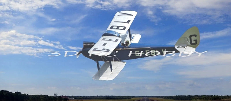 RC model airplane with white wings and dark fuselage, flying with propellers