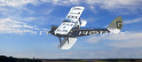 RC model airplane with white wings and dark fuselage, flying with propellers