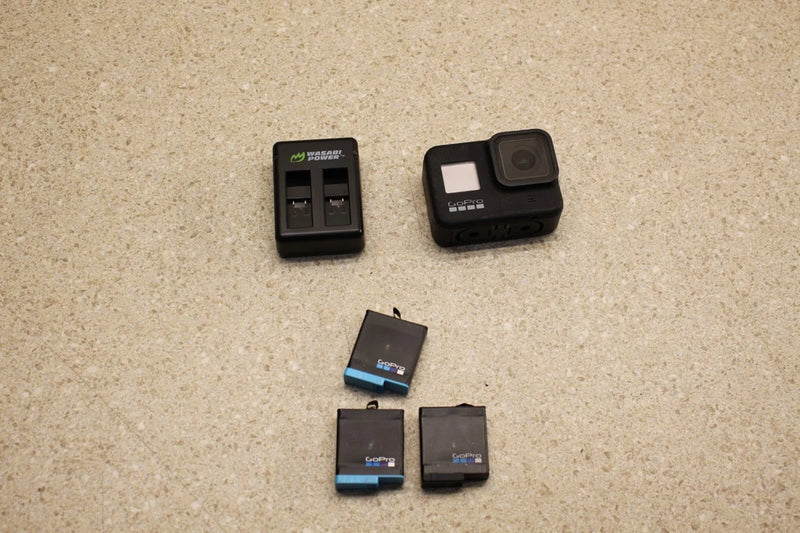 Action camera battery and charger kit with two batteries and a charging station