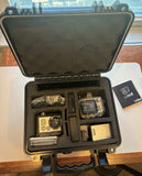 GoPro HERO2 HD action camera kit open case with cameras, mounts, and MicroSD card