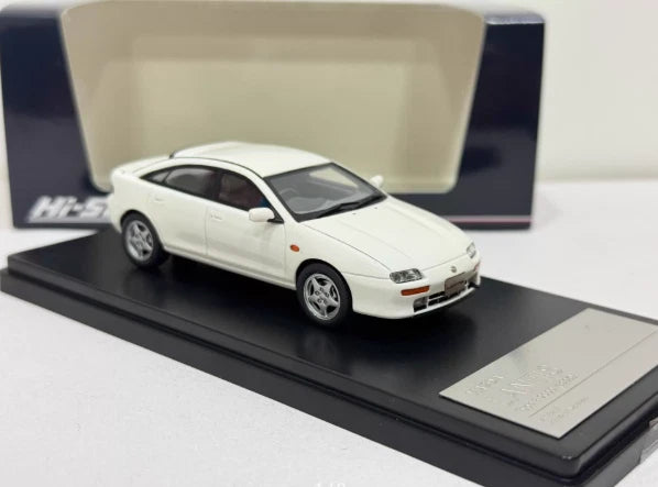White 1/43 Mazda Lantis die-cast car model on display base