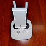 White remote controller with two antennas and power button