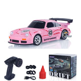Pink 1:43 RC drift racing car with number 43 decals, front headlights and 4WD stance