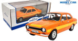 Orange die-cast model of Ford Escort MKI RS with white stripes, front 3/4, in box