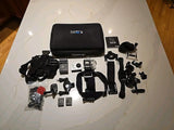 GoPro Hero 3 Silver action camera bundle with black case and mounting accessories