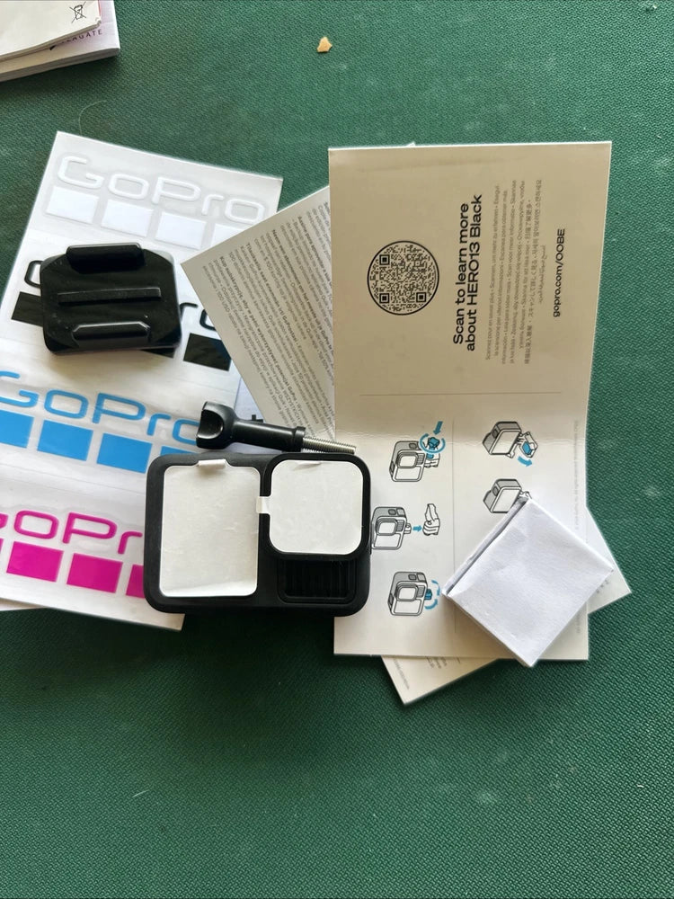 GoPro Hero13 Black action camera kit with black mounts and instruction papers