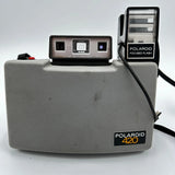 Vintage Polaroid 420 land camera with Polaroid 420 label and flash housing