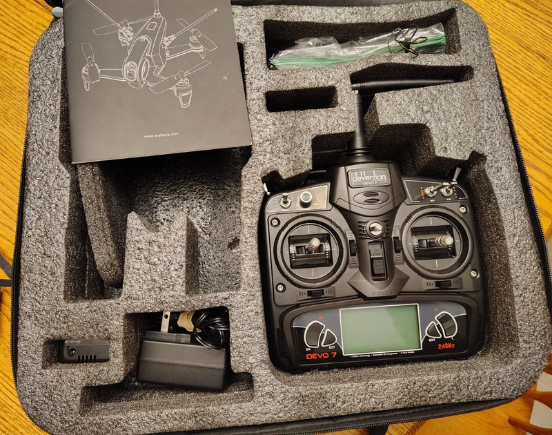 Drone controller transmitter with LCD screen in foam case, with control sticks