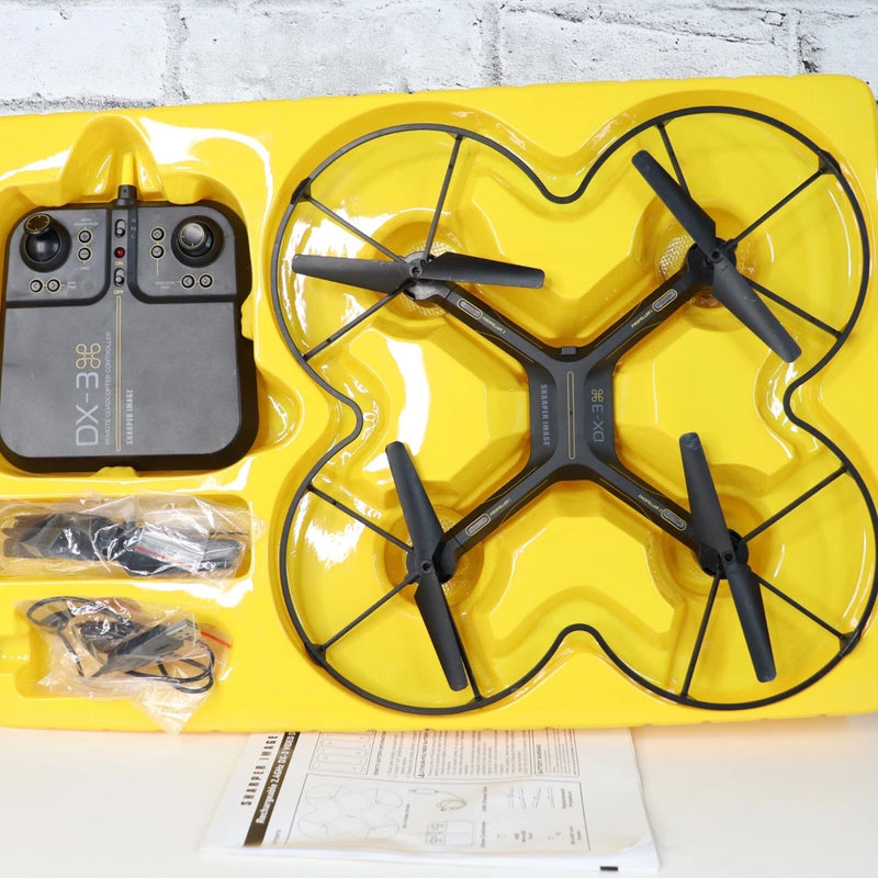 Yellow 4-blade DX-3 drone with remote controller and accessories in plastic tray