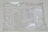 White plastic model kit sprue with battery and step parts in clear bag