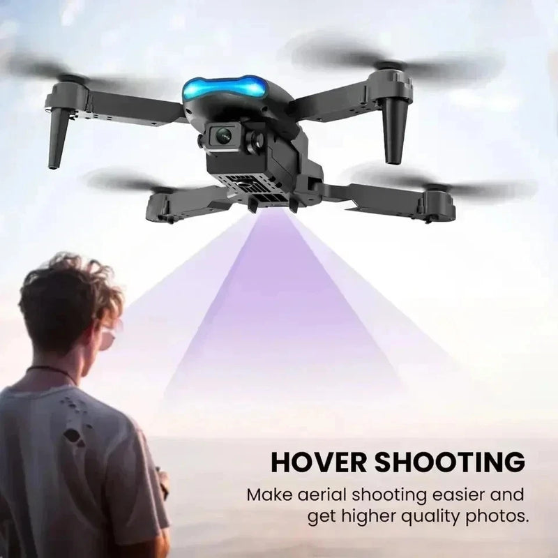 Quadcopter drone with blue LED lights and front camera gimbal
