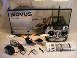 RC 3D helicopter kit with 2.4G controller, antennas, and spare parts in box