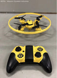 Yellow mini quadcopter drone with black controller