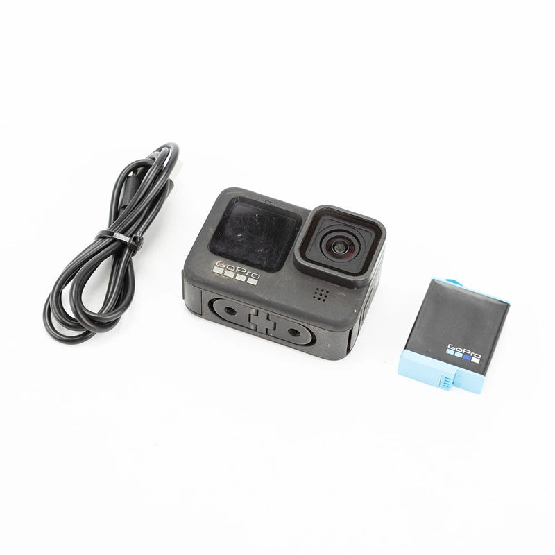 GoPro HERO9 Black action camera with front lens, USB cable, and battery