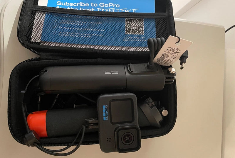 GoPro HERO11 Black action camera in zip case with mount and orange accessory