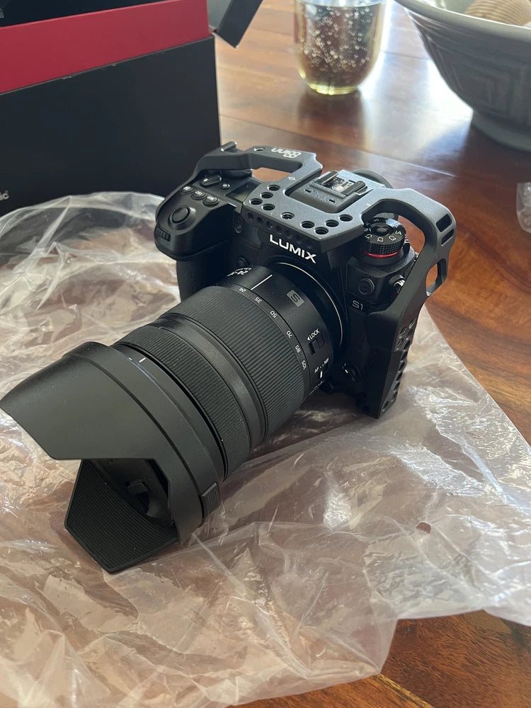 Panasonic Lumix SR1 Camera with 24-105mm Lens, Accessories, and Porta Brace Bag.