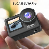 Black SJCAM action camera with front lens and rear LCD screen in hand