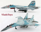 Light blue gray Su-35S Flanker-E model jet with red 07 markings and ECM pods