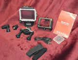 Sports action camera kit with waterproof case, touchscreen, mounts, strap, and USB cable