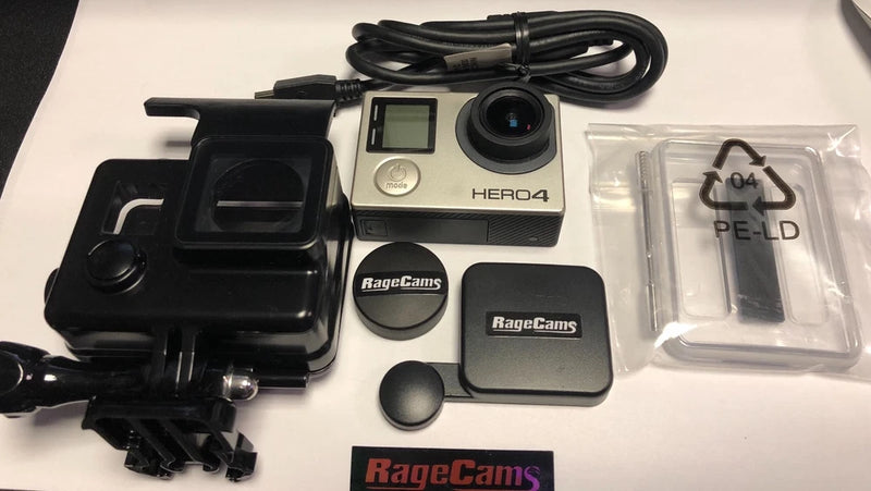Black GoPro HERO4 action camera with waterproof housing, LCD screen, lens, and accessories