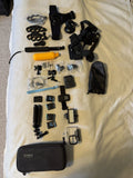 GoPro HERO 9 action camera bundle with camera housing, mounts, remote, and carrying case