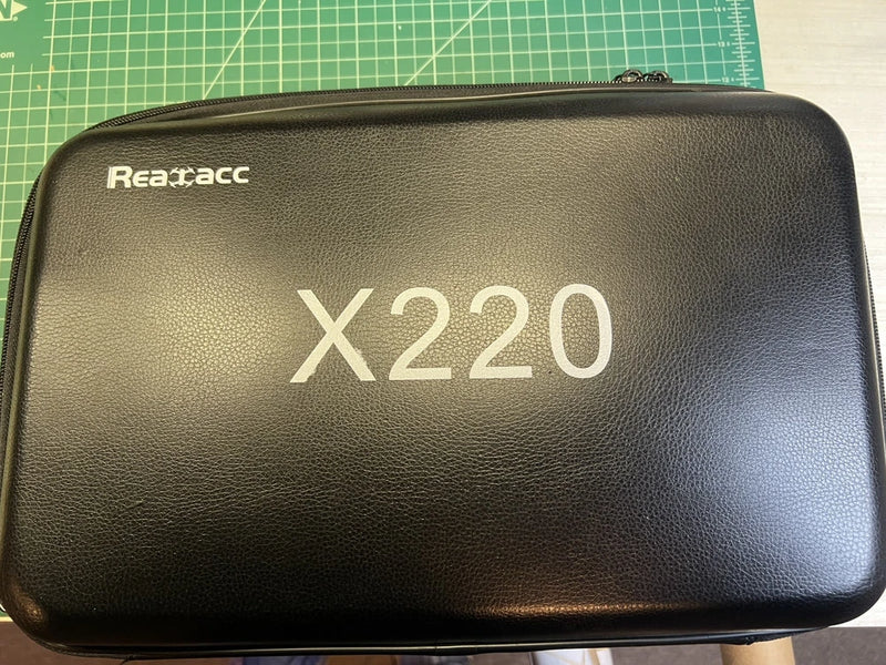 Realacc X220 hard-shell drone carrying case with zipper, black textured exterior