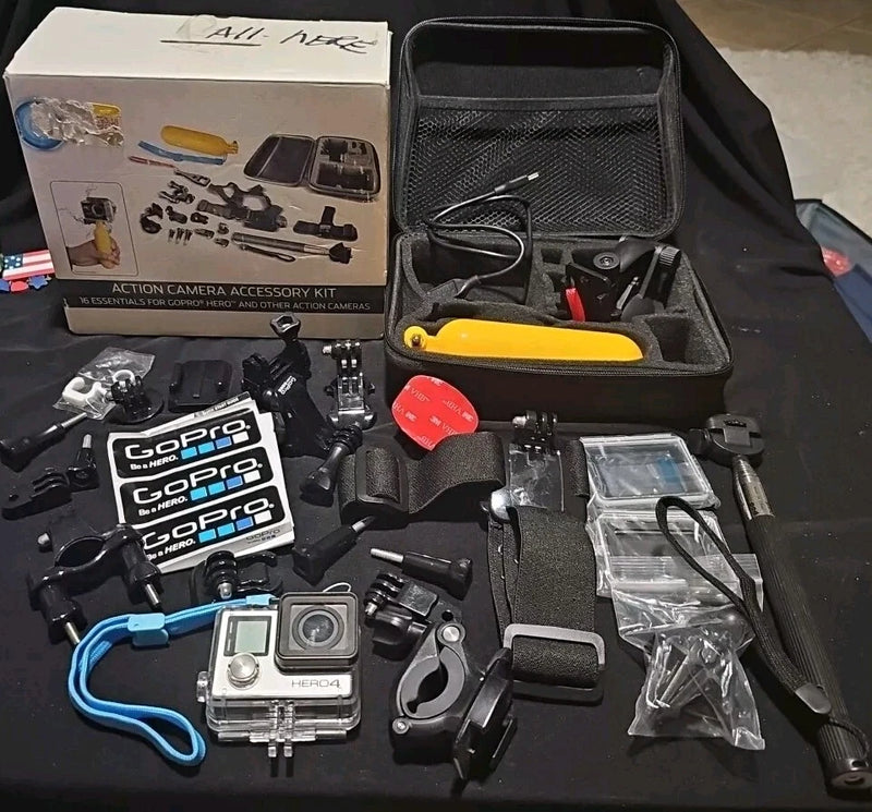 GoPro Hero 4 action camera accessory kit with camera, mounts, waterproof case and accessories