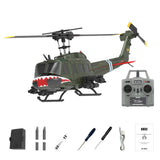 Green RC military helicopter with red markings, plus gray transmitter and included parts