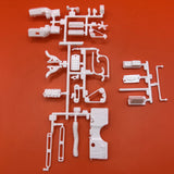 White plastic model parts sprue for engine and battery, 1:25