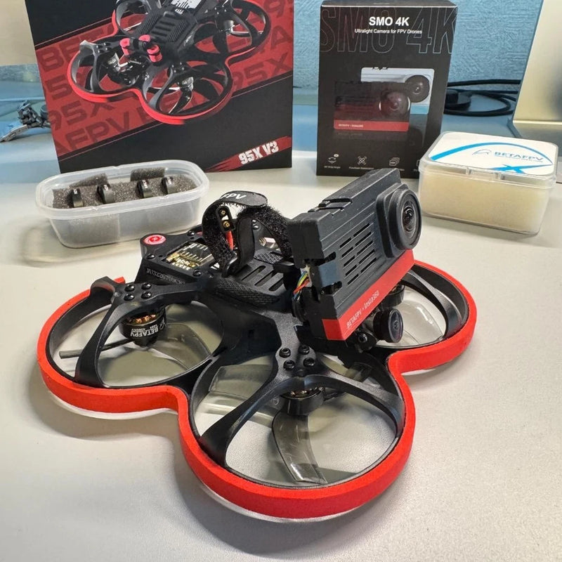 Betafpv cinewhoop drone with 4K camera, red and black ducted quad frame