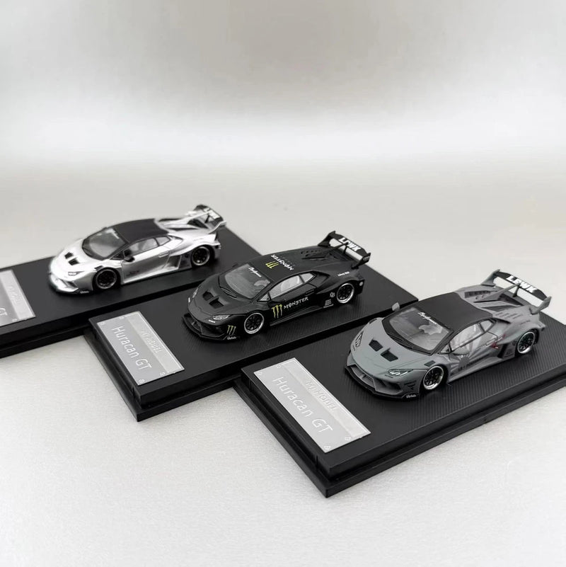 Die-cast supercar model ornament set: white, black, and gray cars on display bases.