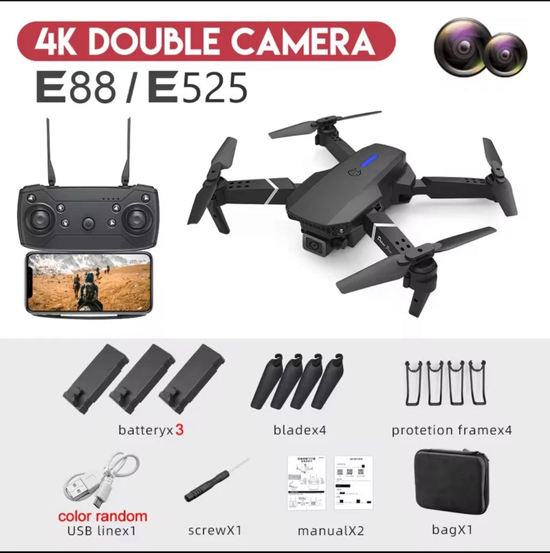 Black RC quadcopter drone with remote controller, propellers, and spare parts kit