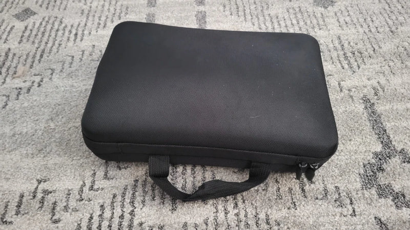 Black carrying case with handle for action camera