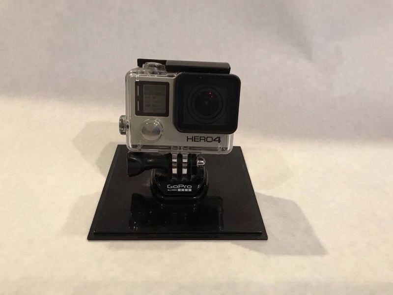 GoPro HERO4 Black action camera with clear housing and front lens on base