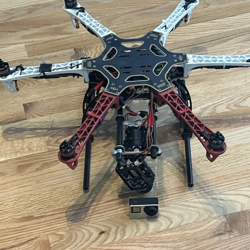 Custom quadcopter drone frame with gimbal camera and landing legs