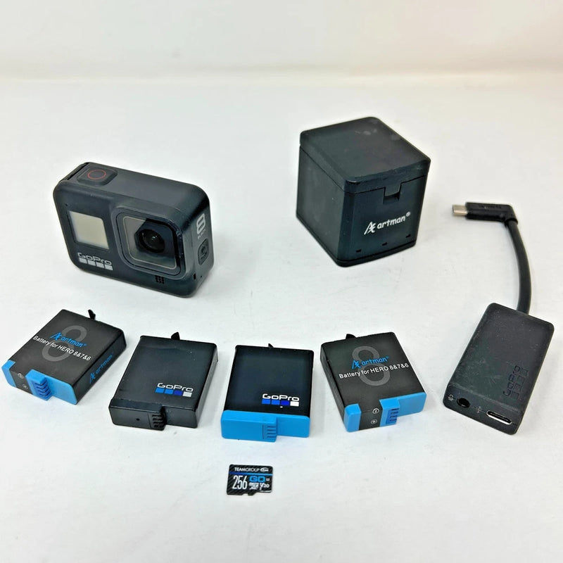 GoPro action camera kit with black Hero8, charger, batteries, SD memory card and cable