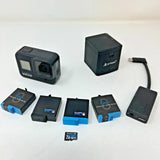 GoPro action camera kit with black Hero8, charger, batteries, SD memory card and cable