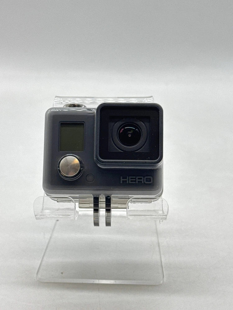 GoPro action camera with front display, large lens, and HERO branding in clear housing