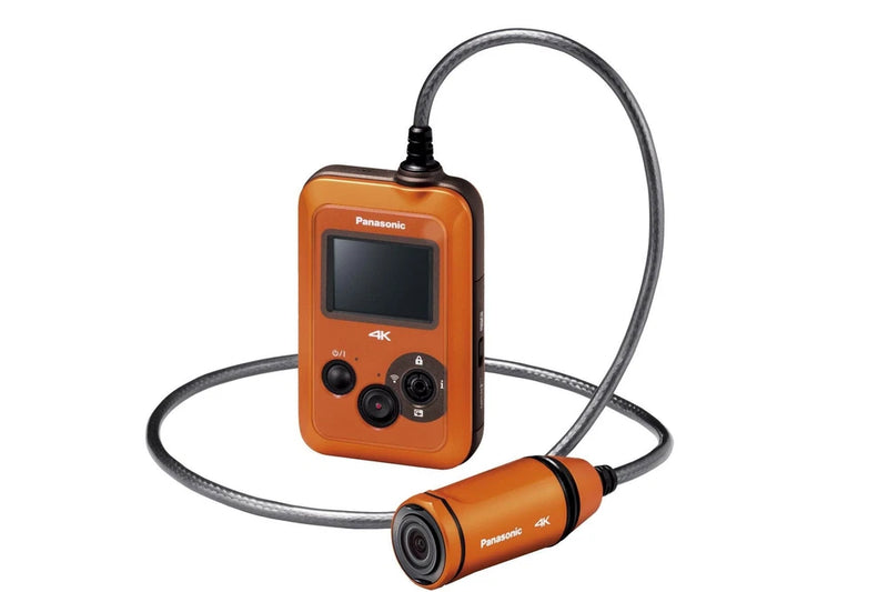 Panasonic wearable 4K camera in orange with small display, buttons, and connected lens module