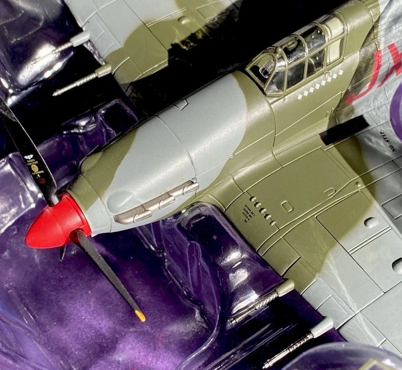 Olive-green WWII fighter model aircraft with silver nose and cockpit windows
