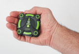 Pocket FPV drone in hand, green and black four-rotor frame