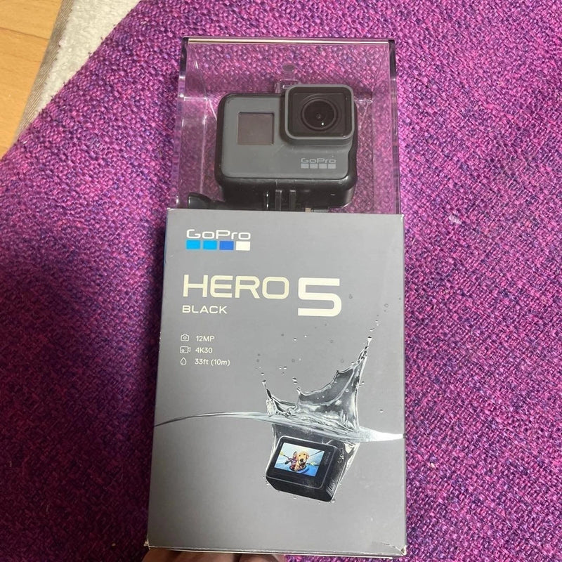 GoPro HERO5 Black action camera in retail box with mounted camera
