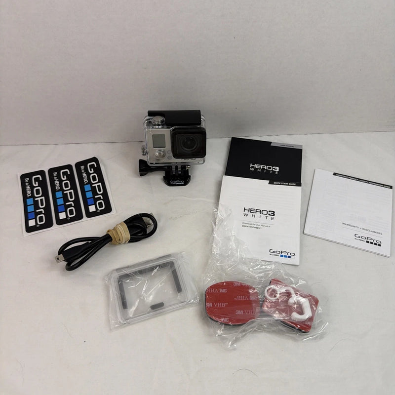 White action camera with black housing, accessories and manuals