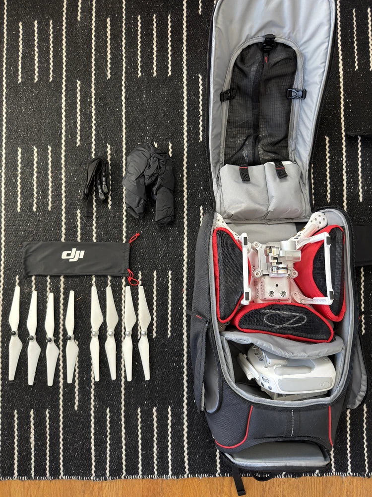 DJI Phantom 3 4K drone in open Manfrotto backpack case with accessories pouch