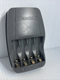 Duracell battery recharger base with four charging slots and wall plug contacts