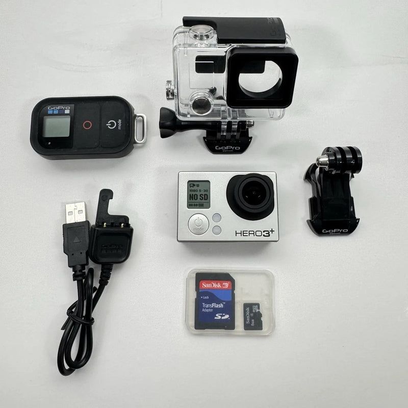 GoPro HERO3+ silver action camera bundle with housing, mounts, cable, and SD card